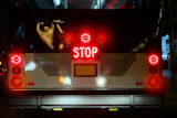 Bus+stop+signal+glowing++red+with+traffic+lights
