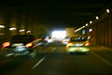 Cars+moving+traffic+with+brurred++blur+headlights+on+the+tunnel