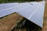 Solar+cell+panels+in+a+row+on+Mediterranean+electric+plant