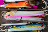 Colorful+fishing+saltwater+fish+lures+in+a+box%2C+rusted+hooks