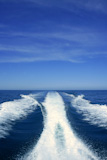 Fishing+speedy+boat+prop+wash%2C+white+wake+on+the+blue+ocean+sea