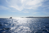 Blue+Mediterranean+sea+with+fishing+boat+far+in+horizon