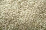 White+rice+close+up+texture.+Background+pattern+of+rice+seeds+from+Spain