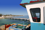 boat+ferry+control+cabin+with+caribbean+sea+on+background