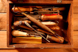 srtist+hand+tools+for+handcraft+works+on+golden+wood+background