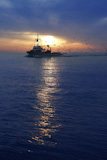 professional+fishing+boat+and+seagull+turn+back+port+on+sunset+sunrise++