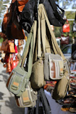 bags+hanging+in+market+shop+green+khaki+brown+colors+