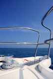 boat+bow+sailing+on+blue+sea+with+anchor+chain+and+winch+detail