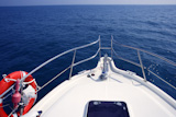 blue+ocean+sea+view+from+motorboat+yacht+bow+in+Mediterranean