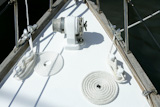 sailboat+white+bow+with+bollard+and+spiral+rope+moored+on+port