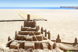 Beach+sand+castle+summer+vacation+street+art+blue+sea+background