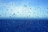 Abstract+backdrop+blue+water+drops+on+a+boat+glass+window+background