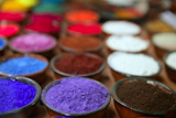colorful+powder+pigments+in+rows+in+clay+bowls