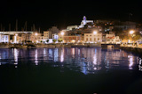 Ibiza+island+harbor+and+city+under+night+light+in+Mediterranean+sea