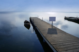 Albufera+lake+wetlands+pier+with+boat+in+Valencia+Spain