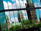Ottawa+Parliament+Buildings+reflecting+in+glass.
