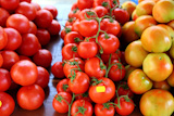 Tomatoes+stacked+in+vegetables+market+different+species