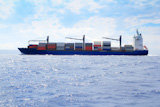 sea+cargo+merchant+ship+sailing+in+blue+ocean+full+of+containers