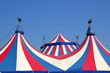 Circus+tent+under+blue+sky+colorful+stripes+red+white