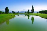 Golf+course+green+grass+field+lake+trees+reflection
