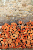firewood+wood+pile+stacked+triangle+shape+red+color