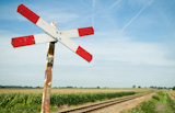 An+old+railway+sign+near+a+small+railway+in+Holland%2C+Netherlands.