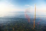 Beach+Volleyball+net+in+low+water%2C+horizontal+frame