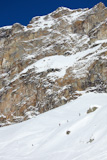 A+group+of+freeriders+go+downhill+in+fresh+snow.+Alagna%2C+Piemonte%2C+Italy.