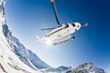 Heli+Skiing+Helicopter+is+landing+on+a+ski+slope+in+Gressoney+Ski+Resort%2C+Aosta%2C+Italy.