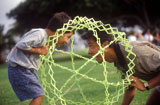 Father+And+Son+Playing+With+A+Hoberman+Sphere+In+The+Park
