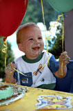 Little+Boy+Laughing+After+Making+A+Mess+At+His+Party
