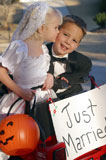 Little+Bride+Giving+Her+Groom+A+Trick-Or-Treat+Kiss