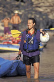 Woman+Walking+Her+Inflatable+Kayak+Out+Of+The+River