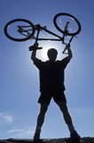 Man+Holding+Bicycle+Over+His+Head