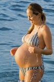 Pregnant+Woman+Splashing+Water+on+Belly