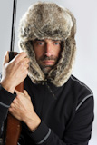 hunter+winter+fur+hat+man+portrait+holding+gun