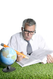 senior+student+teacher+humor+glasses+world+map+book+big+pencil+green+grass+desk