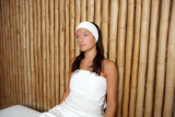 bamboo+spa+woman+sitting+relaxed+after+massage+treatment