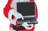 Santa+Claus+Holding+a+Laptop+Computer