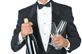 Man+Wearing+Tuxedo+Holding+Champagne+Bottle+and+Glasses