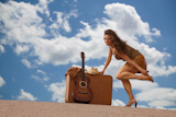 Pretty+woman+with+suitcase+and+guitar