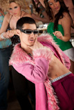 Handsome+Asian+man+in+fluffy+pink+coat+at+a+1970%27s+disco+party