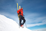 Male+backcountry+skier+against+blue+sky%3B+italian+alps