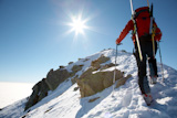 Male+ski-climber+climbing+a+snowy+ridge%3B+horizontal+frame.+Italian+alps.