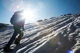 Lone+male+mountain+climber+climbing+a+snowy+ridge%3B+Mont+Blanc%2C+Europe.