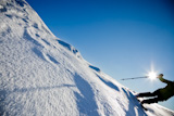 Freerider+skier+moving+down+in+snow+powder+at+sunset+%28detail%29
