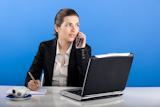 Businesswoman+calling+at+phone