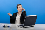 Businesswoman+calling+at+phone