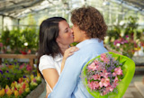 couple+kissing+in+flower+nursery