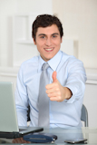 Portrait+of+businessman+with+thumb+up